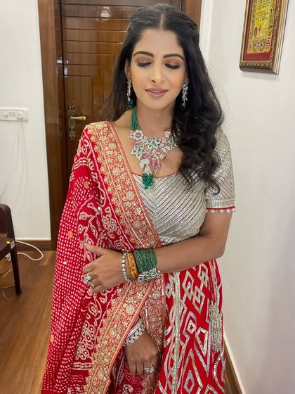 With eyes closed, you can see the soft blend of colors that create the sunset effect, a popular choice for Indian festive makeup.