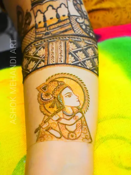 A close-up of a portrait of Lord Krishna, showcasing the fine lines and delicate shading I use to create divine figures. This type of spiritual art is a popular request for bridal mehndi, adding a layer of blessings to the celebration.