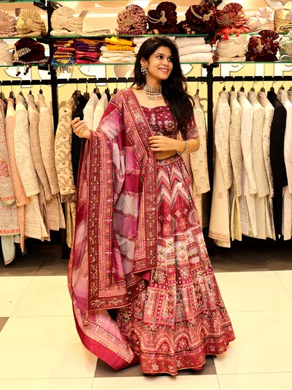 This maroon lehenga is a great example of the rich, detailed outfits you can rent for a wedding. The intricate patterns on the skirt, paired with a matching blouse and a beautifully bordered dupatta, create a complete and unforgettable bridal or guest look.