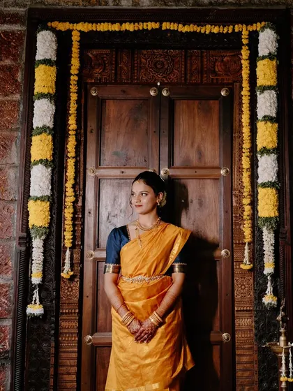 This bride is ready for her engagement in a traditional Madisar saree. I am experienced in draping this nine-yard saree and creating a makeup look that honors the tradition.