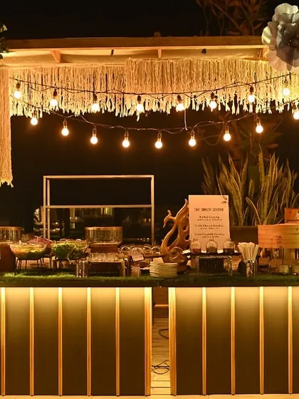 A beautifully decorated live station at an evening event, complete with ambient lighting. This setup housed our popular live dimsum and sushi counters.