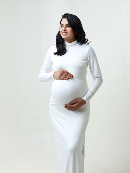 A simple turn of the head can change the mood of a photo. This serene portrait in the white gown is peaceful and elegant.