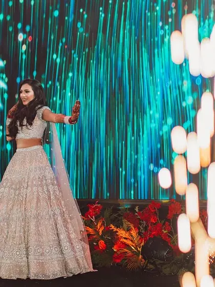 Every performance tells a story. This bride's solo was a stunning visual, with cold pyros and a vibrant LED screen creating a spectacular and memorable moment.