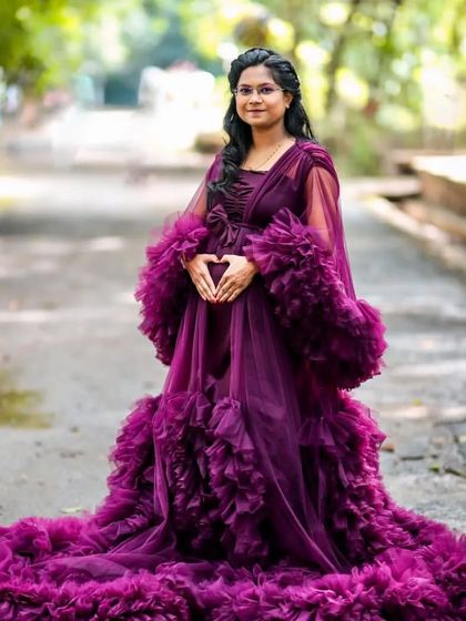 Celebrating the beautiful journey of motherhood. This full-length view shows the incredible detail and volume of my purple ruffled maternity gown. The long train spreads out beautifully for dramatic ground poses.