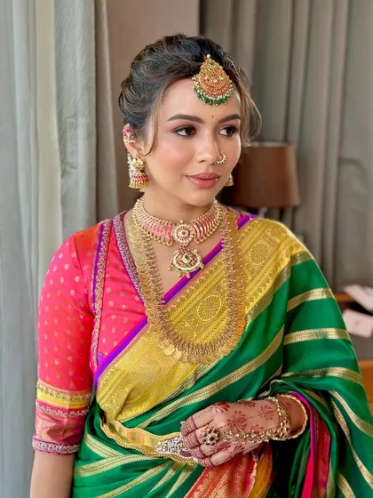A candid moment showing the natural radiance of the makeup in soft, indoor lighting.