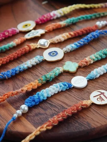 A lineup of all my braided rakhi designs, including the Kundan, evil eye, and clover styles.