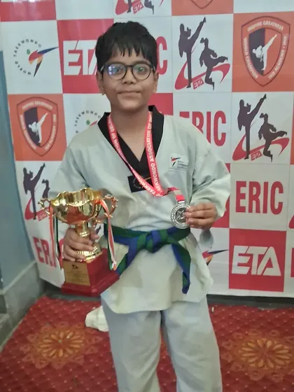 Another champion in the making. This student's success at the competition reflects his dedication during our martial arts training sessions.
