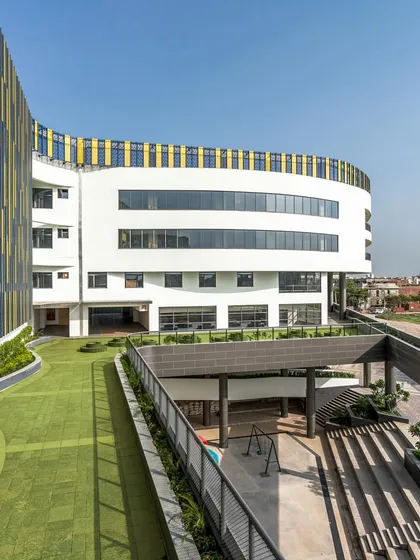 The site for Amity International School, Mohali, presented challenges of size and orientation. We responded by elevating the playground to a podium level, which frees up the ground floor for efficient vehicle circulation while creating ample breakout spaces for students.