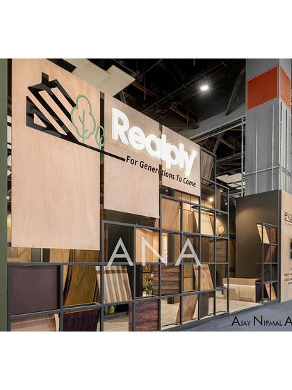 The facade of the Realply '23 stall features a multi-layered display of veneer samples in a metal grid. This creates a visually rich texture and immediately communicates the brand's core product.