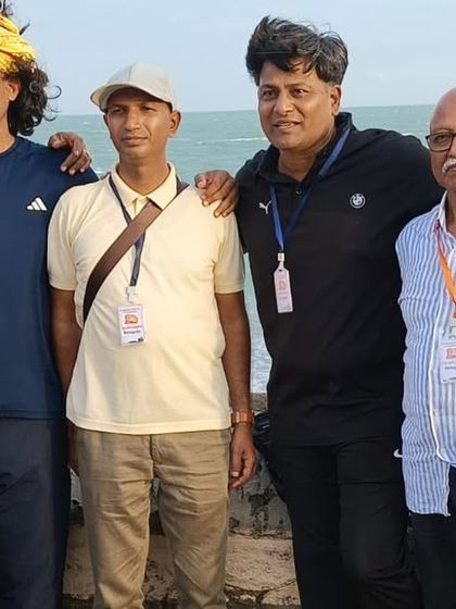 Our male team members and fellow conference attendees enjoying the serene coastal view at Kanyakumari.