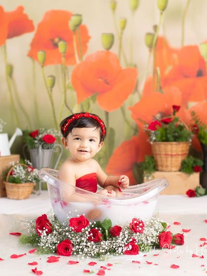A lovely Valentine-themed milk bath with red roses and a poppy backdrop. This setup is perfect for capturing sweet and romantic photos of your little one.
