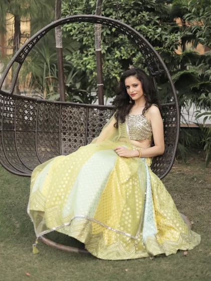 A beautiful solo shot of our client in the lime green lehenga, perfect for a garden party or daytime event.