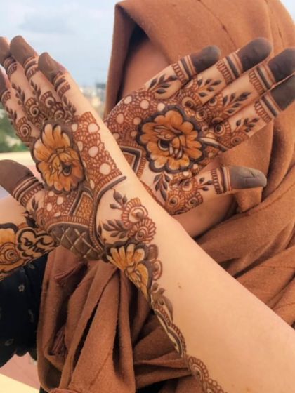 A playful pose with the personalized bridal mehendi.