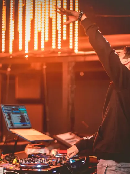Reaching for the lights, sequencing the music to take the crowd on a journey.