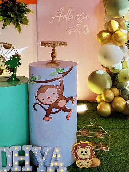 A close-up of the monkey-themed decor, showing a cute monkey character on a custom-printed plinth.