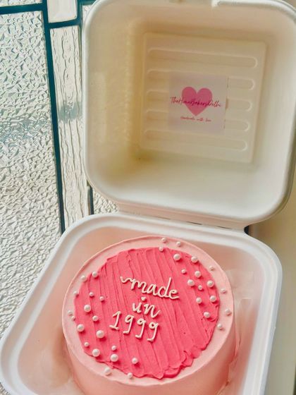 A 'Made in 1999' bento cake for all the 90s kids. This retro-themed cake with its bright pink textured top is a fun nod to a great decade.