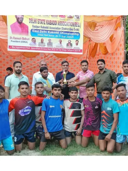 Our sub-junior team being awarded the 1st place trophy at the Gazipur District Championship.