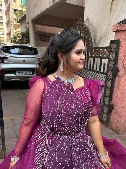 My model looking gorgeous in a purple gown for a makeup demonstration. This look is perfect for a reception or cocktail party.