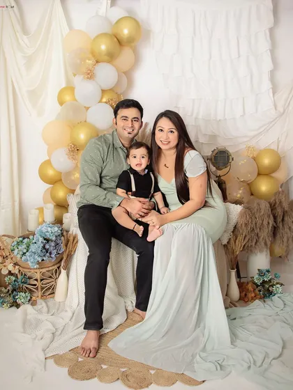 A beautiful family portrait in our boho-chic setup. The soft colors and natural textures create a warm and inviting atmosphere.
