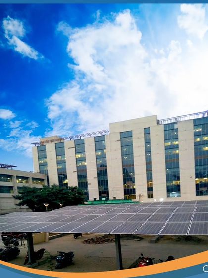 A solar carport installation at a commercial complex. These solutions are part of our diverse on-site portfolio, recognized by Bridge to India, which ranked us as the #1 Project Developer (OPEX) for three consecutive years.