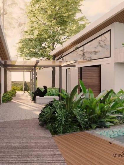A walkway connecting the different zones of the Pai Residence. The design uses a combination of wooden decking and stone pavers, with a semi-covered pergola and integrated planters to create a pleasant and green transition space.