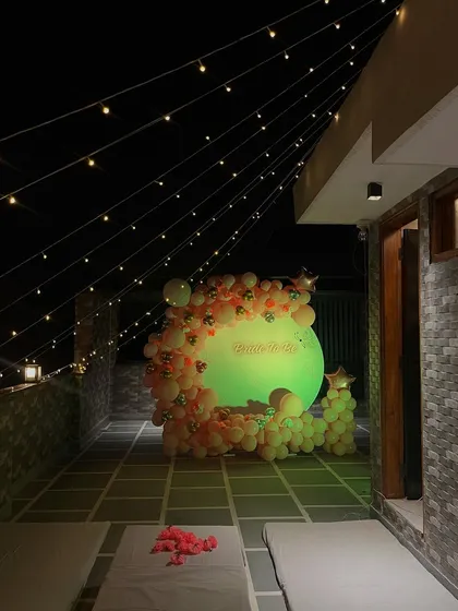 A wider view of the rooftop party setup, with seating arranged for guests.