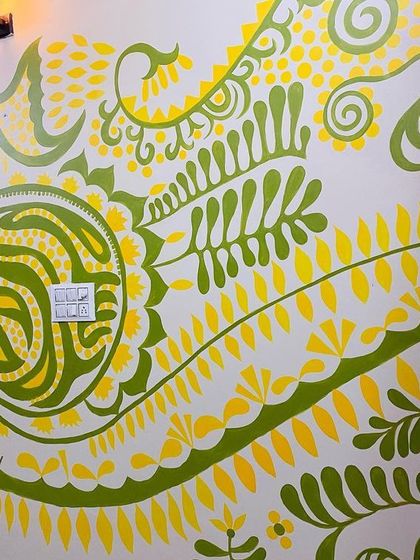 A detailed shot of the intricate patterns in the 'Harmony' mural. The design combines flowing lines with geometric shapes, creating a balanced and dynamic composition.