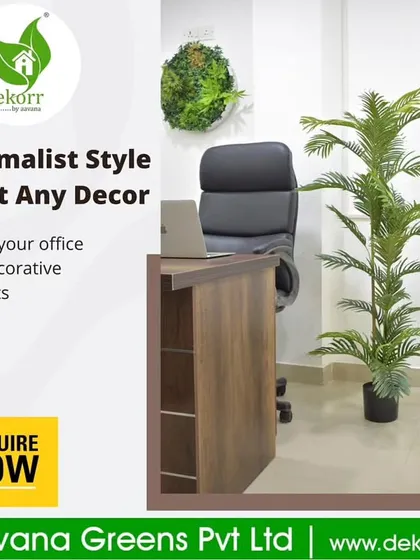 A minimalist style to fit any decor. This office space is enhanced with a tall artificial palm and a small, round green wall art piece, showing that even small touches can make a difference.