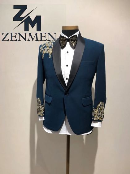 Another view of the teal and gold tuxedo, showing the sharp contrast between the colors. This is a great option for a groom who wants a vibrant reception outfit.