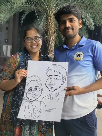 This couple was happy to pose with their joint caricature. These portraits are especially popular at weddings and anniversary parties.