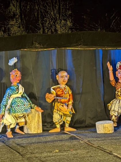 Three characters from one of our productions, showcasing the expressive faces and detailed costumes of our string puppets. Each puppet is manipulated with skill to portray complex characters and emotions from our ancient texts.