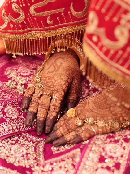 The final stain is so important, and I'm proud of the deep, dark color my organic henna produces. This is how beautifully the mehndi contrasts with a traditional red bridal lehenga, perfect for all your wedding photos.