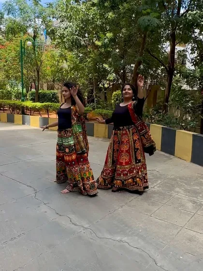 A candid shot from an outdoor Garba dance reel. The colorful traditional skirts and joyful expressions capture the spirit of Navratri.