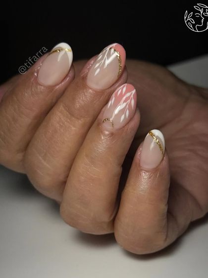 In the world of nails, it's all about the details. Short gel extensions with delicate white and pink floral art for a bride's mother.