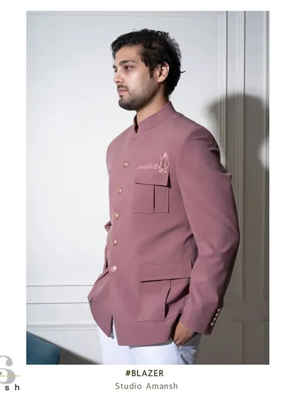 Our pastel pink Prince Coat offers a softer yet equally distinguished look. Tailored in the classic Jodhpuri style with subtle Resham silk embroidery, it's an ideal choice for a sophisticated guest at a summer wedding or engagement party.