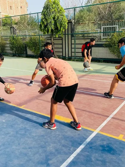 A close-up of a dribbling drill. We use various techniques, including adding a tennis ball, to challenge our players' coordination.
