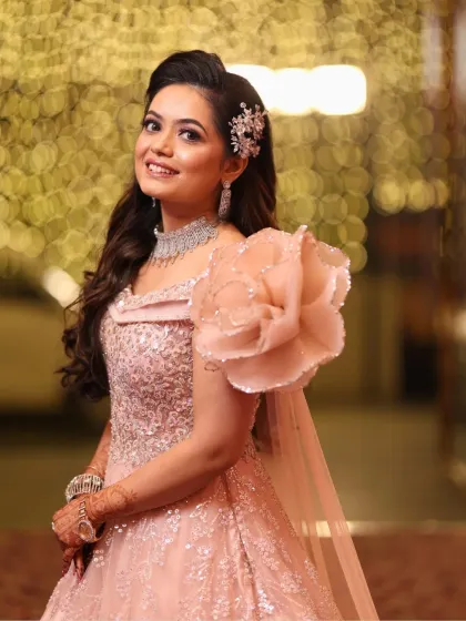 A beautiful portrait of the bride-to-be. Her makeup is minimal yet glamorous, with a focus on radiant skin and soft, defined eyes.