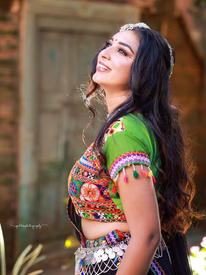 A vibrant and energetic series celebrating Navratri. The model is dressed in colorful Garba attire, and the photos capture the festive spirit through dynamic poses and joyful expressions.