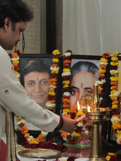 The ceremonial lighting of the lamp in front of the portraits of the great masters, a ritual to seek their blessings before the concert begins.