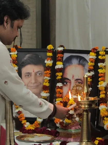 I am seen here lighting the ceremonial lamp to begin our 'Raghunathanjali' baithak. We begin every performance by paying homage to the gurus and seeking their blessings, a cornerstone of our tradition.