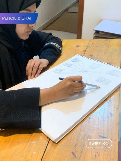 A student practices one-point perspective, a foundational skill that we teach with patience and individual attention.