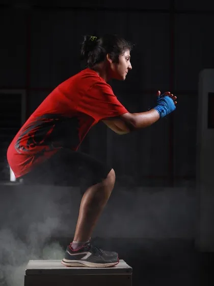 We build functional, explosive power through dynamic exercises like plyometric box jumps. This movement is key for developing the agility and leg strength required in combat sports.