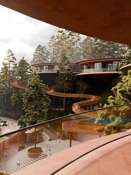 A view from one of the public areas, looking up at the floating villas and the winding skywalk. The design is a testament to how nature can shape architecture.