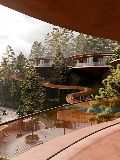 A view from one of the public areas, looking up at the floating villas and the winding skywalk. The design is a testament to how nature can shape architecture.