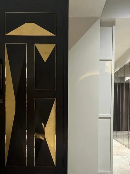 The entry door is the first handshake with the home. For this Juhu apartment, I designed a custom door with bold geometric patterns and brass accents to make a powerful first impression.