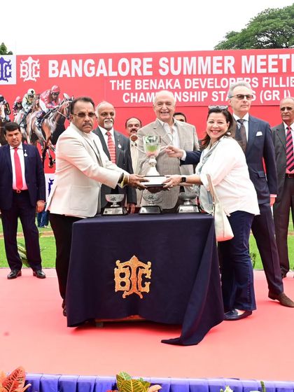 The Benaka Developers Fillies' Championship Stakes (Grade 1) trophy presentation. We provide a platform for brands like Benaka Developers to connect with an audience that appreciates quality and performance.