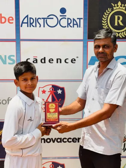 Ujjawal Saroj receiving the Best Bowler award for his excellent performance, taking 2 important wickets for 27 runs in 6 overs.