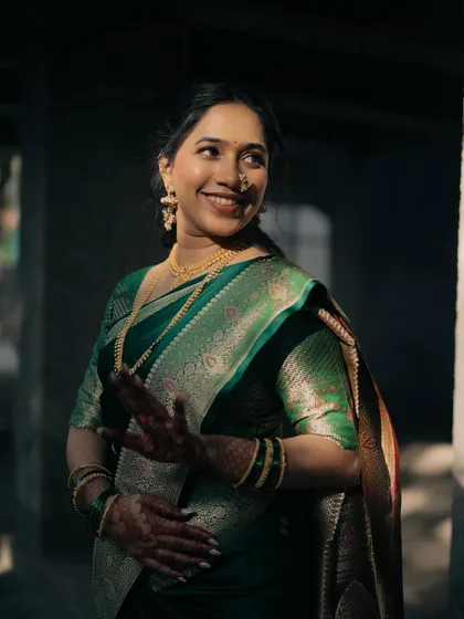 The bride's playful expression is captured perfectly. Her makeup remains flawless and glowing even in candid moments.
