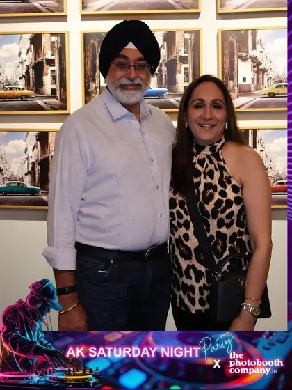 A couple enjoying the bar night. Our photo booth offers a fun activity for guests to enjoy between drinks and dancing.