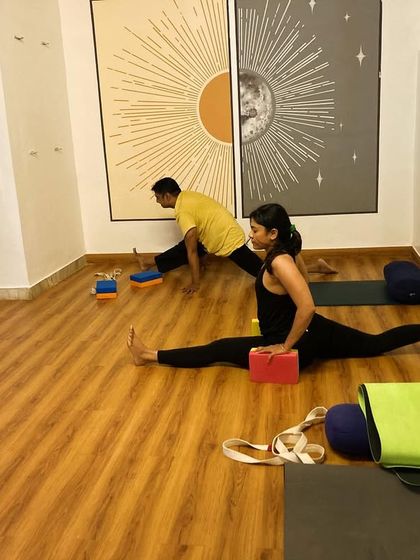 Using blocks for support in Hanumanasana (the splits) helps to stabilize the pose and keep the hips and shoulders square. This allows for a gradual and safe opening.